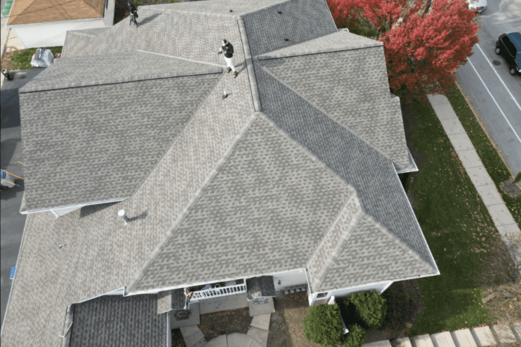 A standingand doing Commercial Roof Inspection Cost