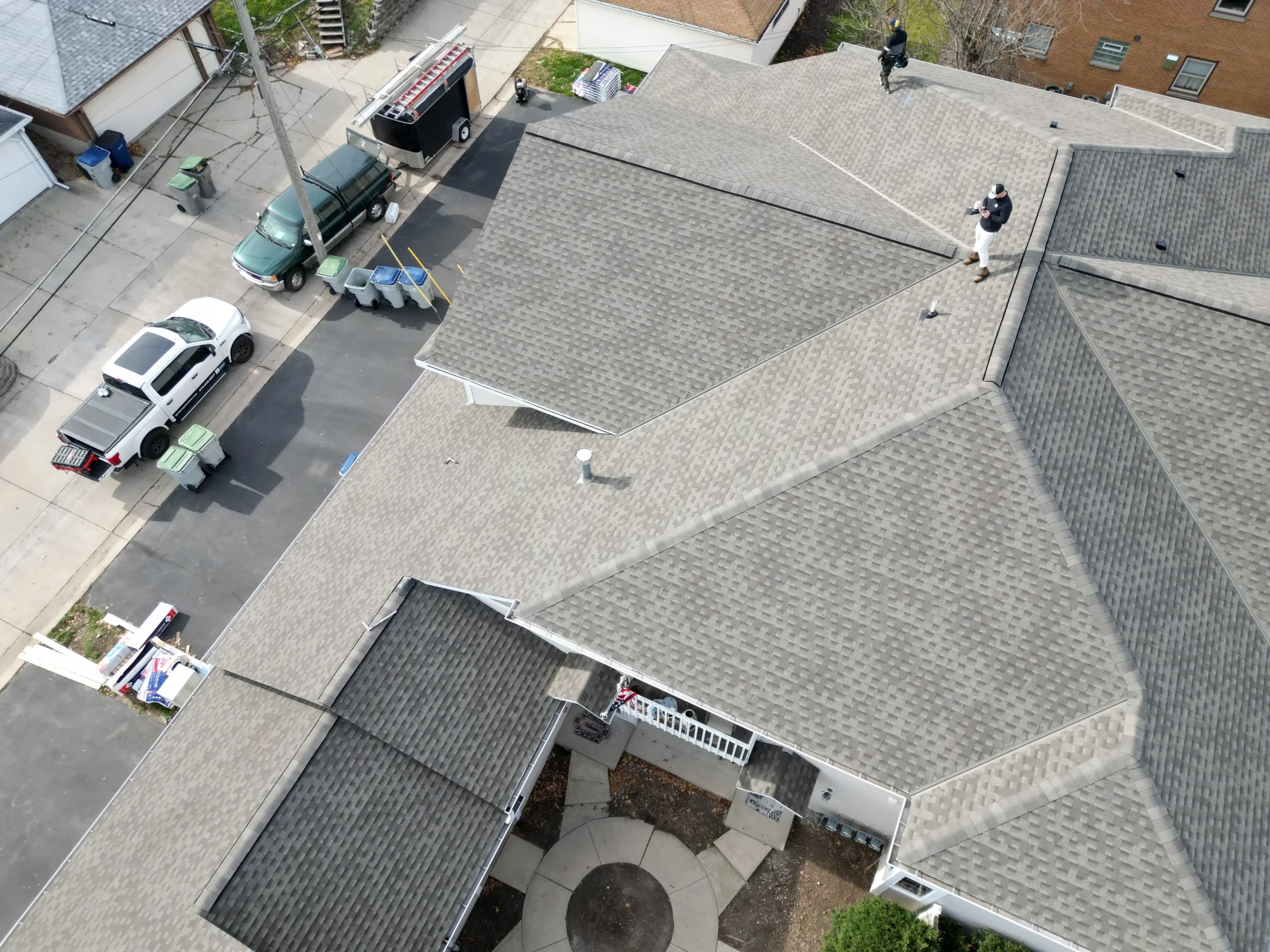 Commercial roofing team working on industrial building